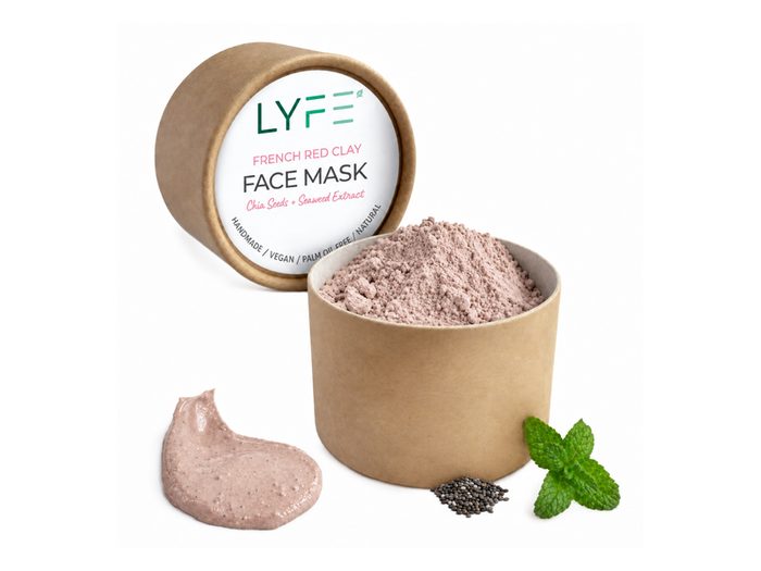 Masker van Franse rode klei in een kraft potje